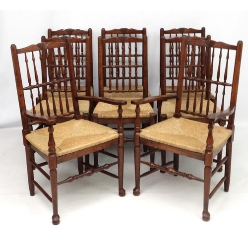 296 - A set of 8 (6+2) oak spindle back chairs with envelope rush seats . the tallest 41 1/2'' high