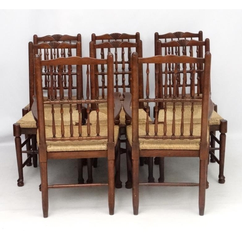 296 - A set of 8 (6+2) oak spindle back chairs with envelope rush seats . the tallest 41 1/2'' high