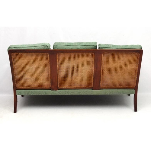 297 - Bright's of Nettlebed : A 20thC bergere suite comprising three seat sofa and 2 armchairs 35'' high