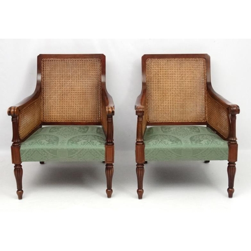 297 - Bright's of Nettlebed : A 20thC bergere suite comprising three seat sofa and 2 armchairs 35'' high