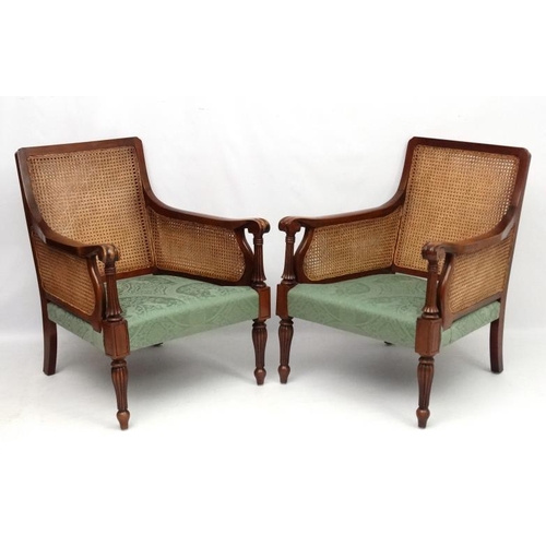 297 - Bright's of Nettlebed : A 20thC bergere suite comprising three seat sofa and 2 armchairs 35'' high