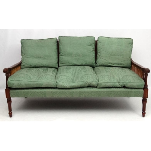 297 - Bright's of Nettlebed : A 20thC bergere suite comprising three seat sofa and 2 armchairs 35'' high