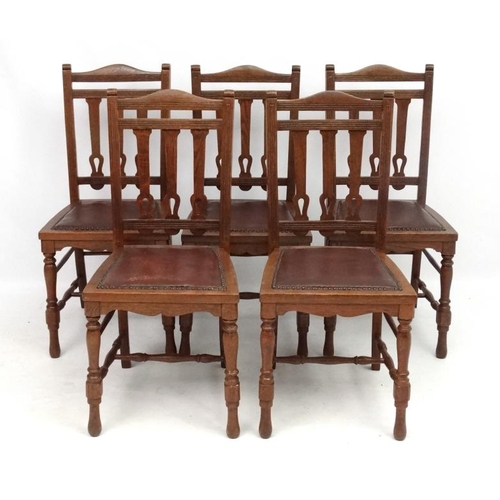 300 - A set of 4 19thC oak leather seated chairs with Arts and Crafts back splats 36 1/2'' high