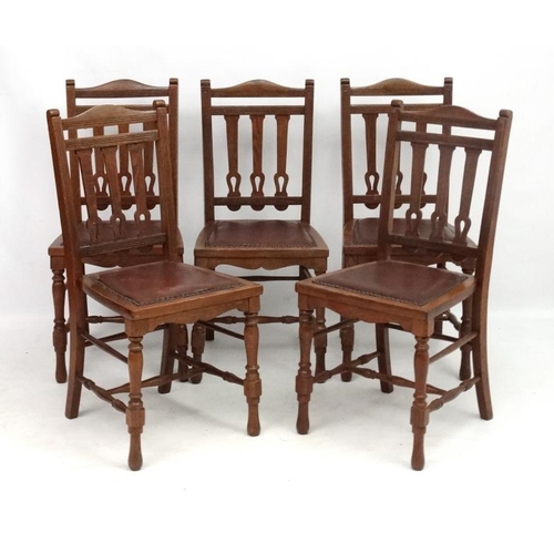 300 - A set of 4 19thC oak leather seated chairs with Arts and Crafts back splats 36 1/2'' high