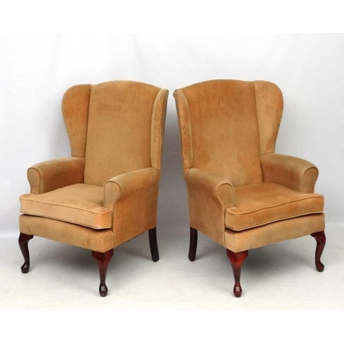 302 - A pair of Victorian style wing back arm chairs 42'' high