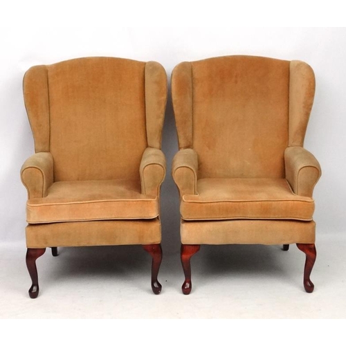 302 - A pair of Victorian style wing back arm chairs 42'' high