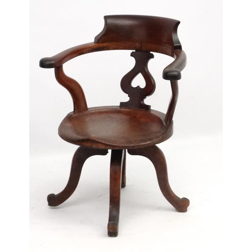 304 - A Victorian walnut swivel open arm office chair 32 1/2'' high