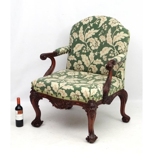 312 - A 19thC Chippendale mahogany open elbow chair with upholstered  back  and seat 40'' high