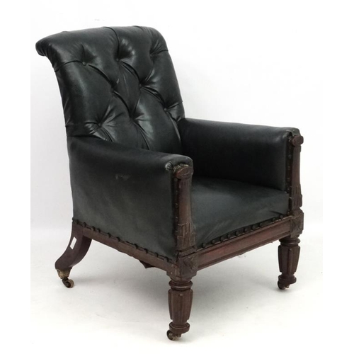 313 - Manner of Gillows : A Geo V button back arm chair with carved show wood 39'' high