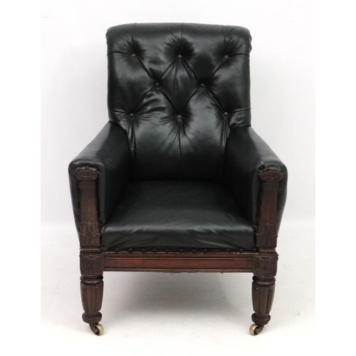 313 - Manner of Gillows : A Geo V button back arm chair with carved show wood 39'' high