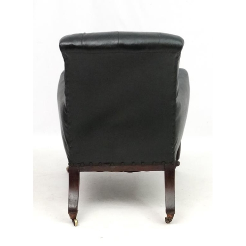 313 - Manner of Gillows : A Geo V button back arm chair with carved show wood 39'' high