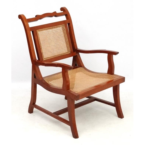 314 - A c.1900 caned colonial hardwood open armchair 34 1/4'' high