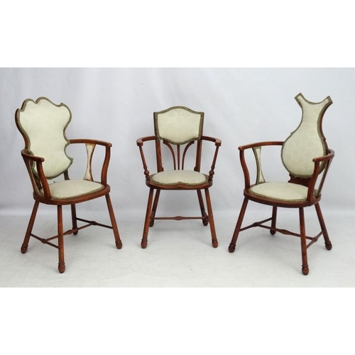 315 - Three Art Nouveau oak and elm armchairs, one marked 'JE' . Possibly  by William Birch.  The tallest ... 