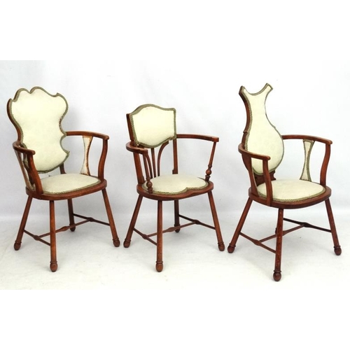 315 - Three Art Nouveau oak and elm armchairs, one marked 'JE' . Possibly  by William Birch.  The tallest ... 