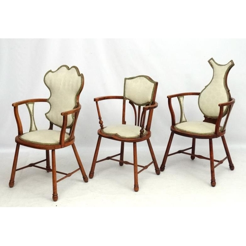 315 - Three Art Nouveau oak and elm armchairs, one marked 'JE' . Possibly  by William Birch.  The tallest ... 