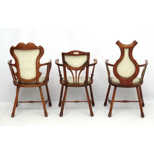 315 - Three Art Nouveau oak and elm armchairs, one marked 'JE' . Possibly  by William Birch.  The tallest ... 