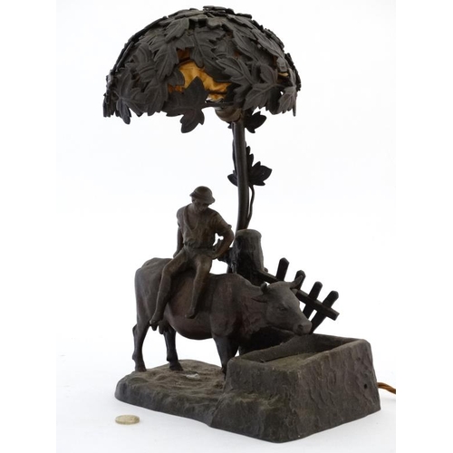 319 - An early 20 thc Cast bronze lamp in the form of an ox watering ( at underllit glass watertrough ) wi... 