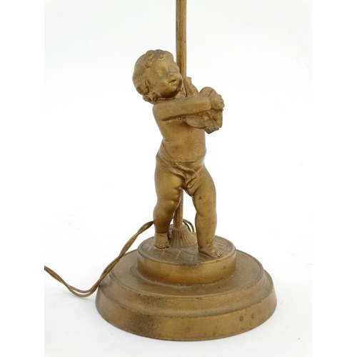 321 - An early 20 thC gilt spelter table lamp formed as a young figure with a bird on a circular socle 14 ... 