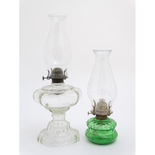 323 - Oil Lamps : two assorted glass lamps ,one green, both with chimneys