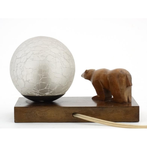 324 - Art Deco bedside lamp/clock with ice glass globe shade and carved wooden polar bear all on a walnut ... 