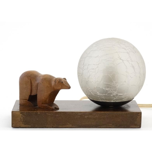 324 - Art Deco bedside lamp/clock with ice glass globe shade and carved wooden polar bear all on a walnut ... 