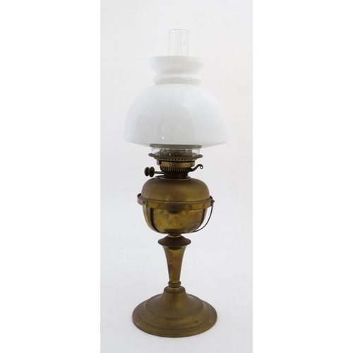 325 - Oil lamp : a Messenger No.2 Brass oil lamp with circular stand and stepped base