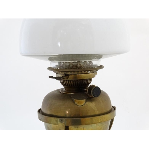 325 - Oil lamp : a Messenger No.2 Brass oil lamp with circular stand and stepped base