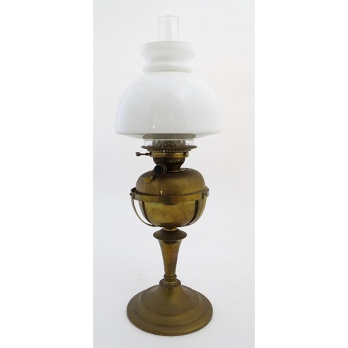 325 - Oil lamp : a Messenger No.2 Brass oil lamp with circular stand and stepped base