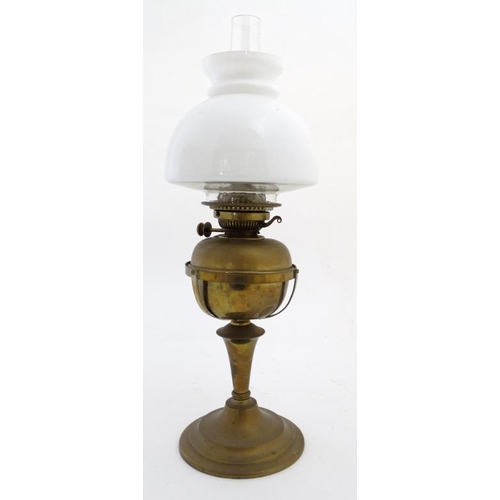 325 - Oil lamp : a Messenger No.2 Brass oil lamp with circular stand and stepped base