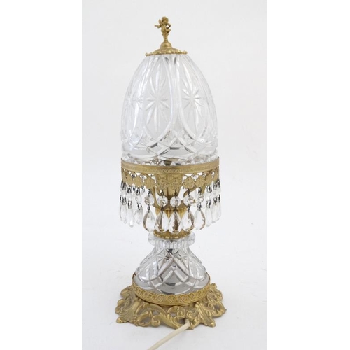 326 - Crystal lamp : an electric clear and frosted glass with ormolou table lamp surmounted by a small che... 