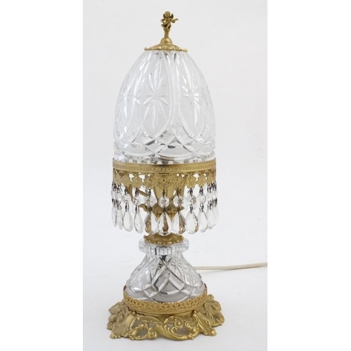 326 - Crystal lamp : an electric clear and frosted glass with ormolou table lamp surmounted by a small che... 