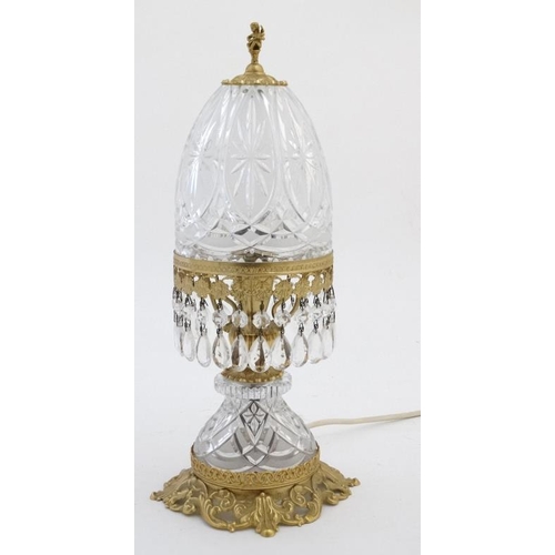 326 - Crystal lamp : an electric clear and frosted glass with ormolou table lamp surmounted by a small che... 