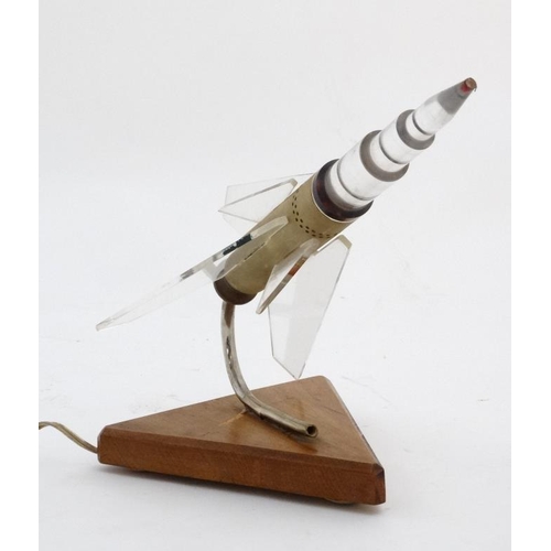 327 - A mid Century Space Race Russian Rocket lamp in the form of a perspex finned Rocket Spaceship angled... 