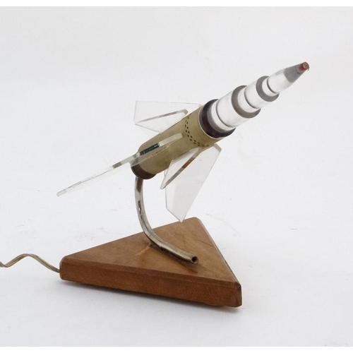 327 - A mid Century Space Race Russian Rocket lamp in the form of a perspex finned Rocket Spaceship angled... 