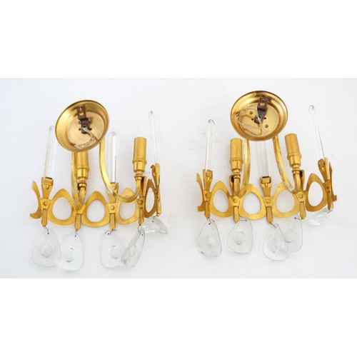 330 - Mid Century / Hollywood/Regency : a  pair of gilt wall lights with droplets and prismatic uprights, ... 