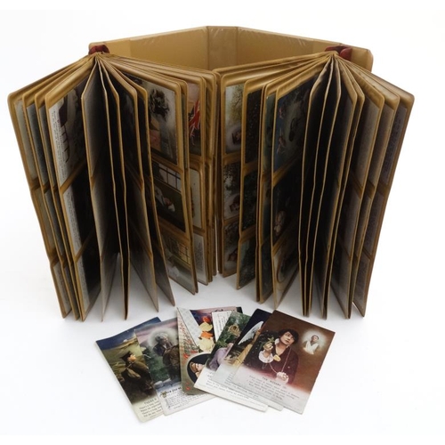 335 - A folder containing approximately 90 mainly World War I postcards, to include examples published by ... 