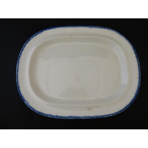 517 - A c1820 Spode blue shell edge / feather edge creamware meat plate, having blue border on a cream gro... 