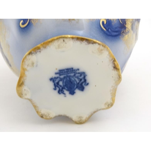 518 - A Victoria ware Ironstone flow blue (flo-blue) style large pitcher and bowl , decorated with flowers... 