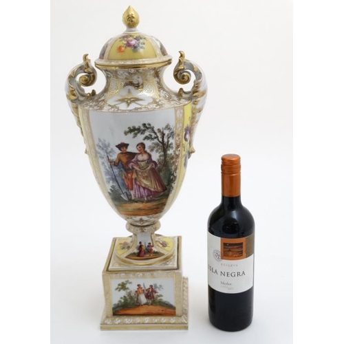 519 - An Austria porcelain twin handled urn vase and cover on stand, having decorative polychrome panels d... 