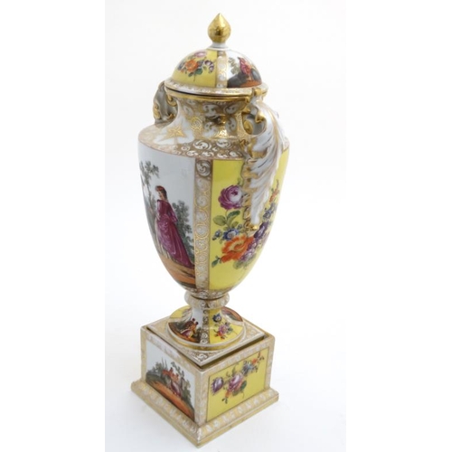 519 - An Austria porcelain twin handled urn vase and cover on stand, having decorative polychrome panels d... 