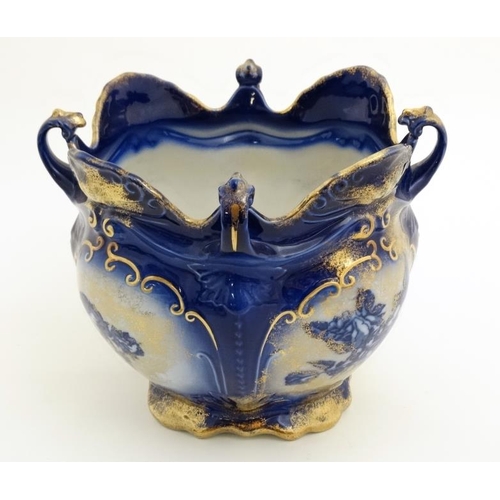 521 - A Victoria ware Ironstone flow blue (flo-blue) style four handled jardiniere , decorated with flower... 