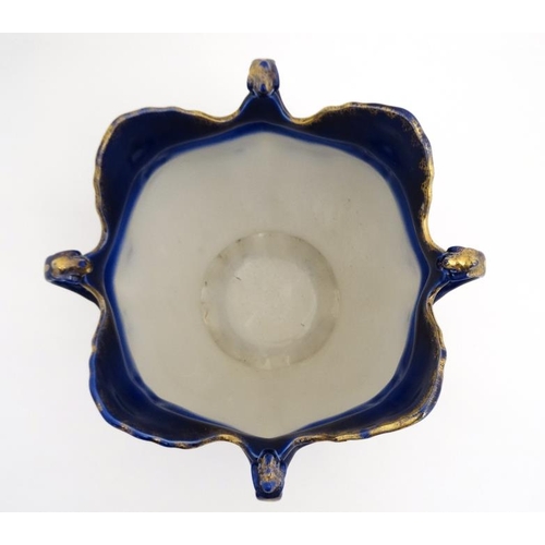 521 - A Victoria ware Ironstone flow blue (flo-blue) style four handled jardiniere , decorated with flower... 