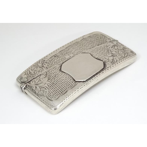 525 - A hip formed card case with engraved decoration. Hallmarked Birmingham 1904 maker Jones & Crompton 3... 