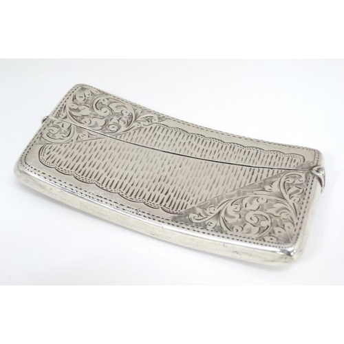 525 - A hip formed card case with engraved decoration. Hallmarked Birmingham 1904 maker Jones & Crompton 3... 