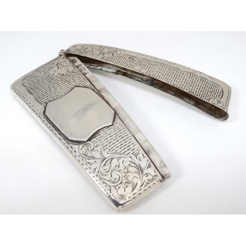 525 - A hip formed card case with engraved decoration. Hallmarked Birmingham 1904 maker Jones & Crompton 3... 