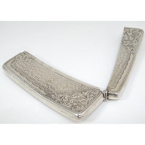 525 - A hip formed card case with engraved decoration. Hallmarked Birmingham 1904 maker Jones & Crompton 3... 