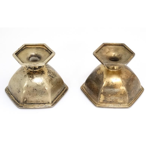 529 - A pair of silver gilt salts of hexagonal pedestal form. Marked Sterling 1 1/4'' high (46g)