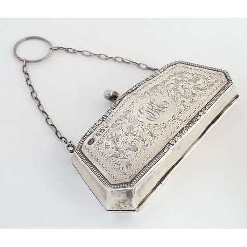 534 - A silver purse with engraved decoration and calf skin lined interior, hallmarked Birmingham 1917 mak... 