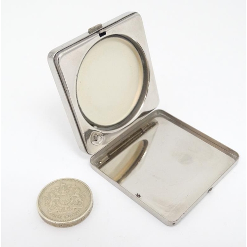 535 - A mid 20thC silver plate ladies powder compact by Coty France with engine turned decoration and mirr... 