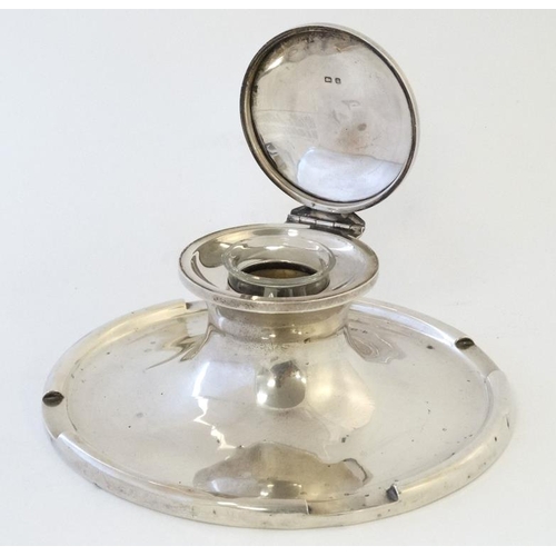 538 - A large silver capstan inkwell hallmarked  Birmingham 1909 maker A & J Zimmerman. The base 7'' diame... 